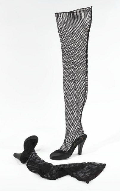 Levine, Beth. Stocking shoes. Black satin silk and nylon fishnet mesh, size 4B. Part of the Brooklyn Museum Costume Collection at the Metropolitan Museum of Art.